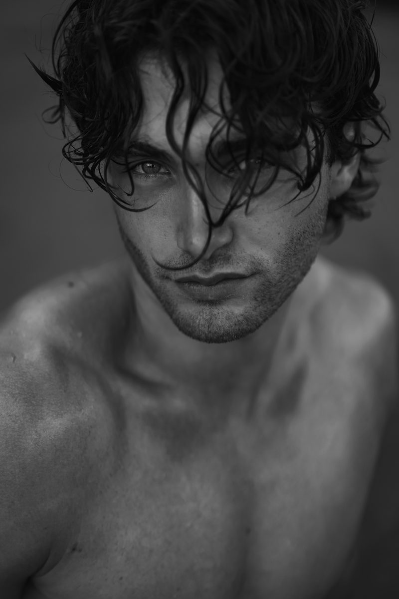 Close black and white portrait with wet hair