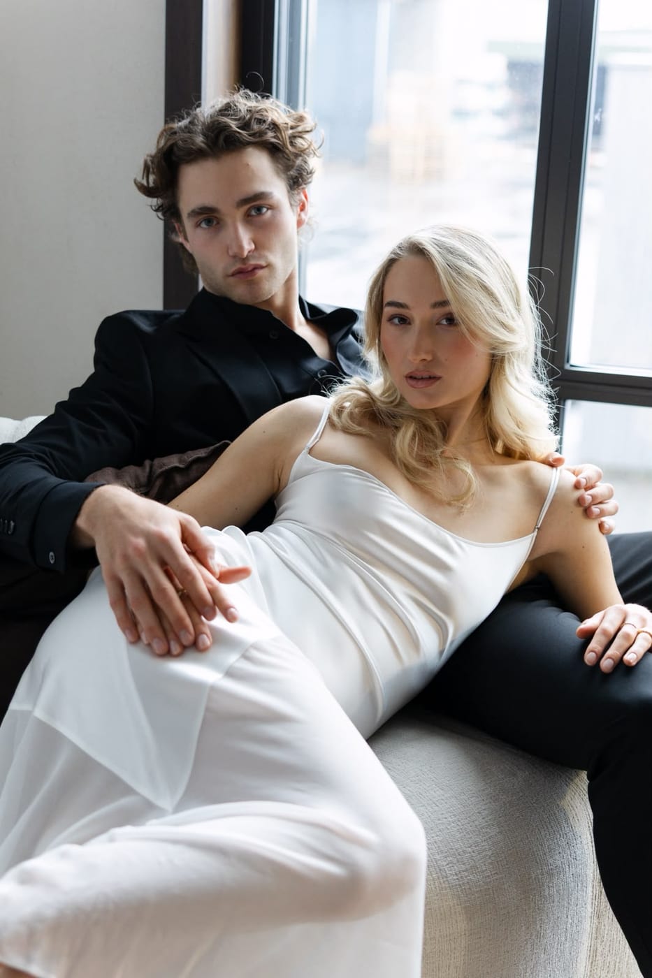 Pascal Sander and a model on white bedding, editorial