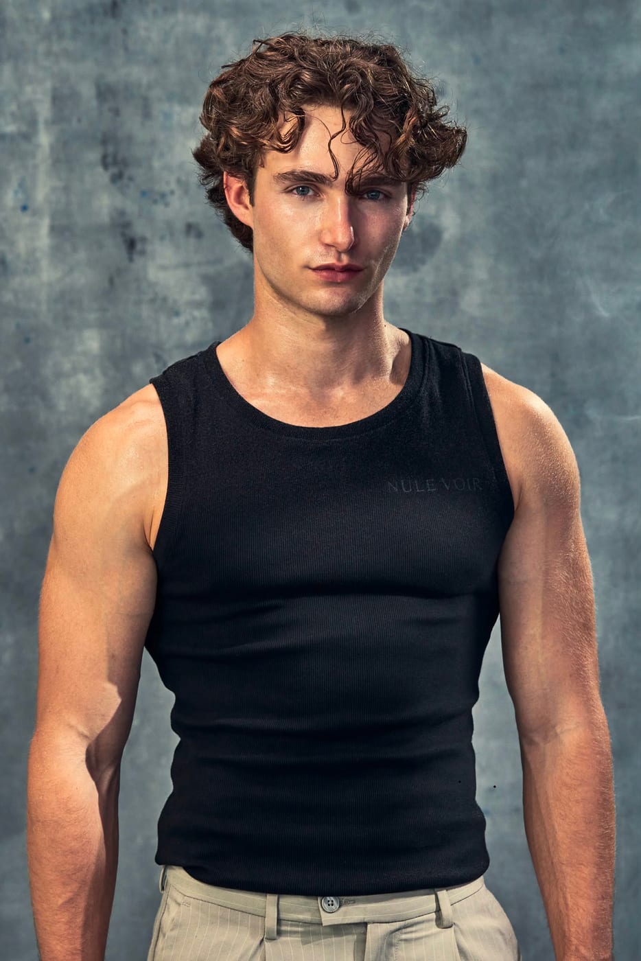 Pascal Sander in a black tank top, studio portrait