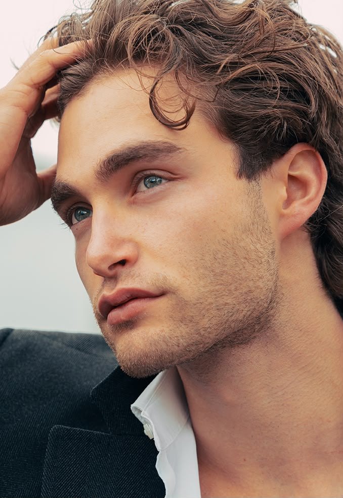 Pascal Sander close up, hand in his hair, blazer and white shirt