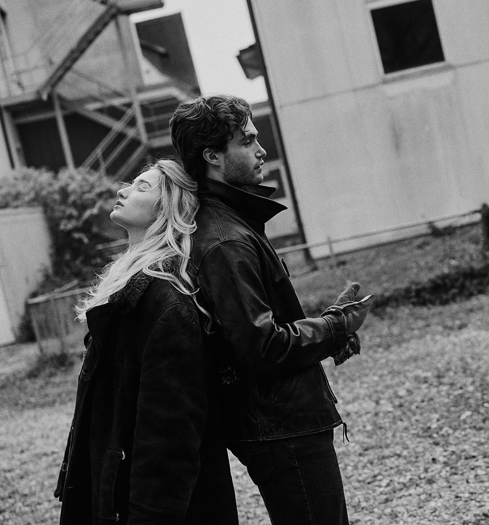 Pascal Sander and a partner outdoors, black and white